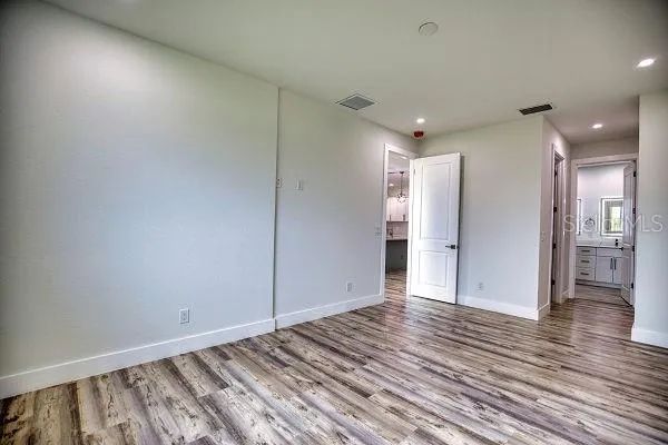 an aerial view of a house with swimming pool and outdoor seating
