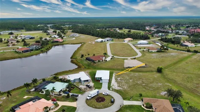 an aerial view of a house with a lake view