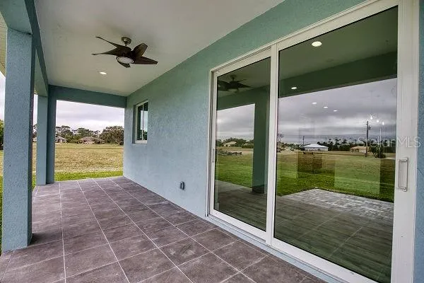 a view of a backyard with plants and a yard