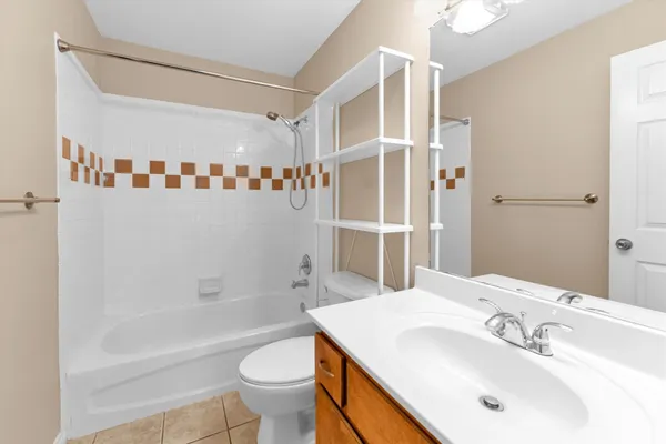 a bathroom with a shower and a toilet