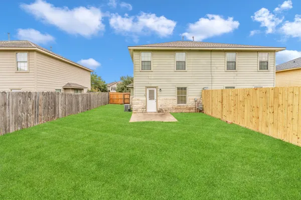 a view of a yard with an ocean view