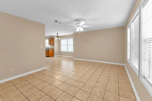 a view of an empty room and a window