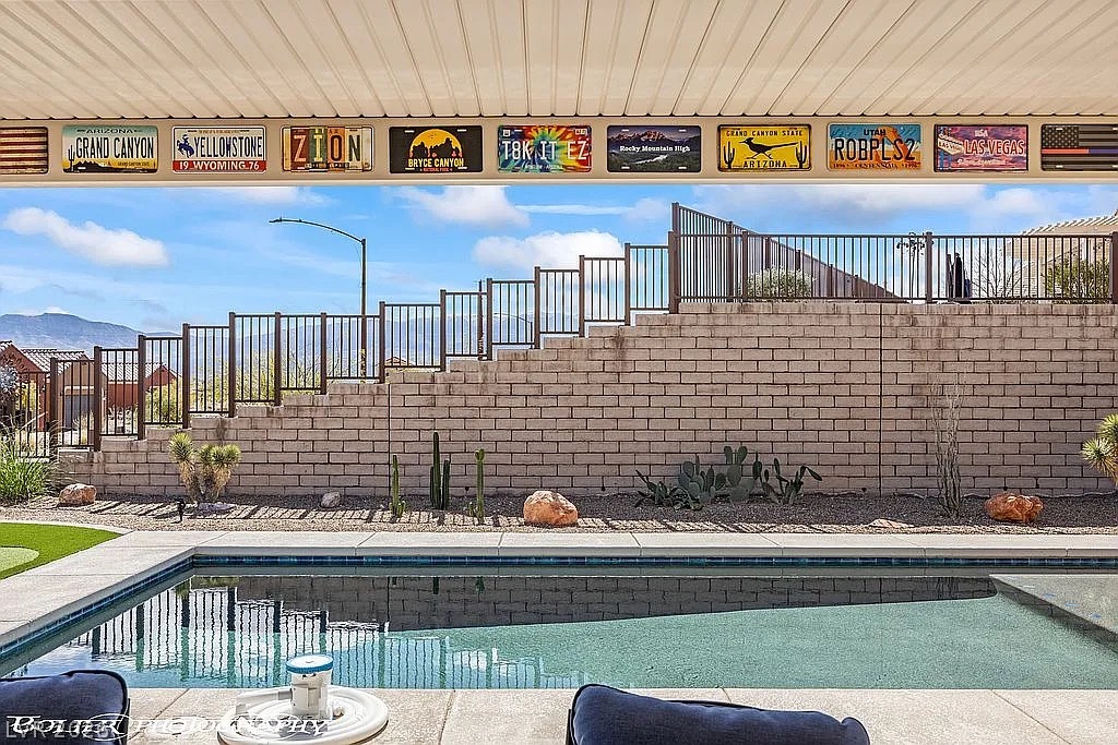 1304 Cottage Ridge Mesquite, NV 89034 - Photo 29 of 52 An inviting backyard oasis offers a sparkling pool and a desert-inspired landscape with natural rock and native plantings.