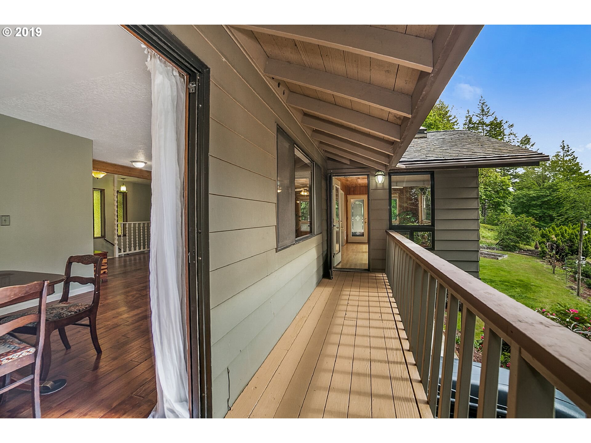 13925 Southeast Wiese Road Damascus, OR 97089 - Photo 15 of 32 a balcony with wooden floor