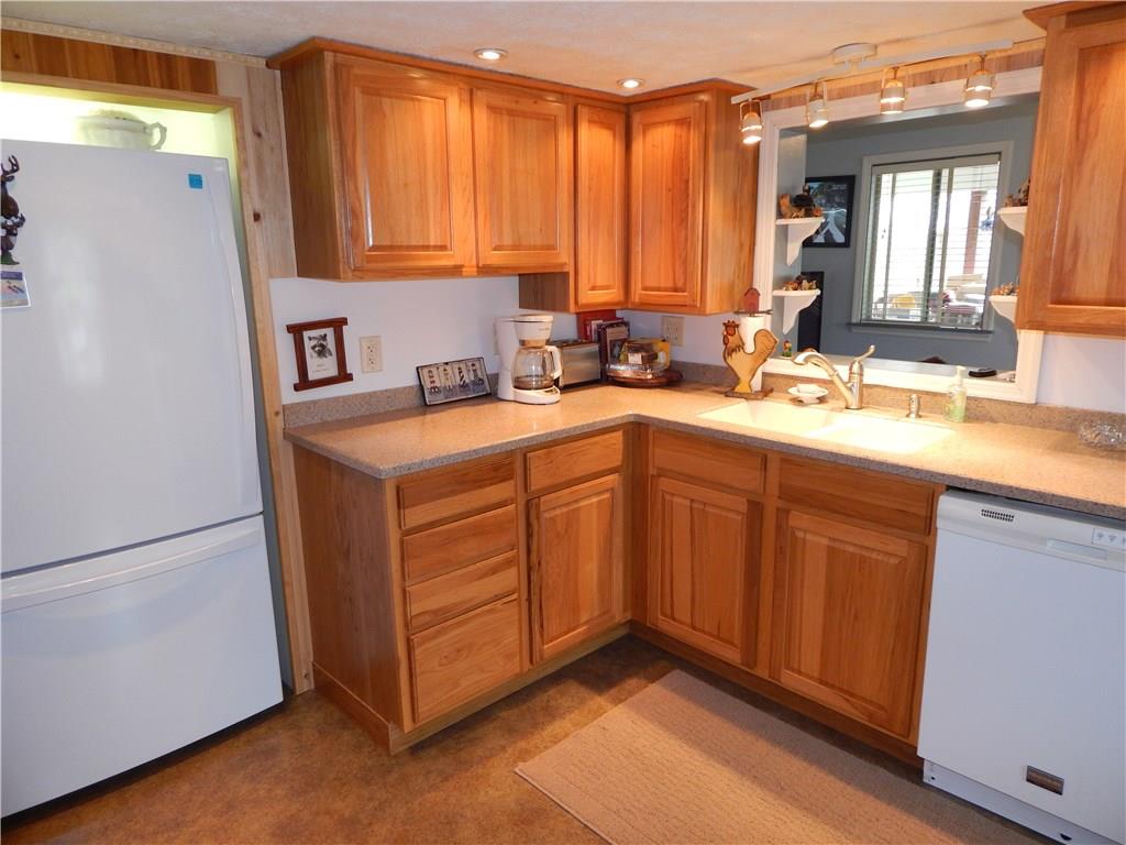 478 Myers Road Eighty Four, PA 15330 - Photo 7 of 18 Beautifully renovated kitchen offers upgraded cabinetry and counter tops. Home comes fully equipped with kitchen appliances. Open window Living Room promotes an open flow throughout.