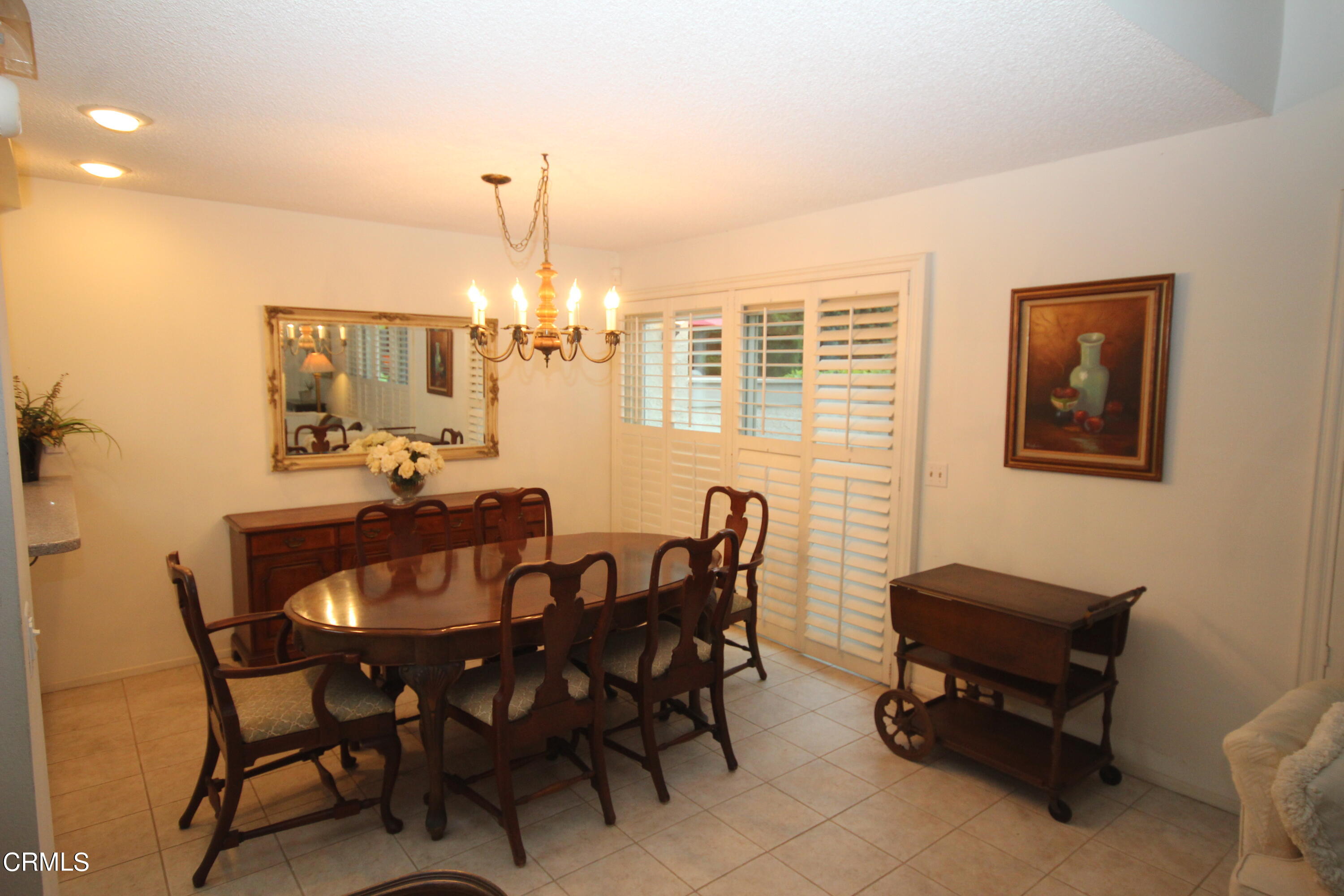 3354 Sunset Lane Oxnard, CA 93035 - Photo 2 of 12 a view of a dining room with furniture and chandelier