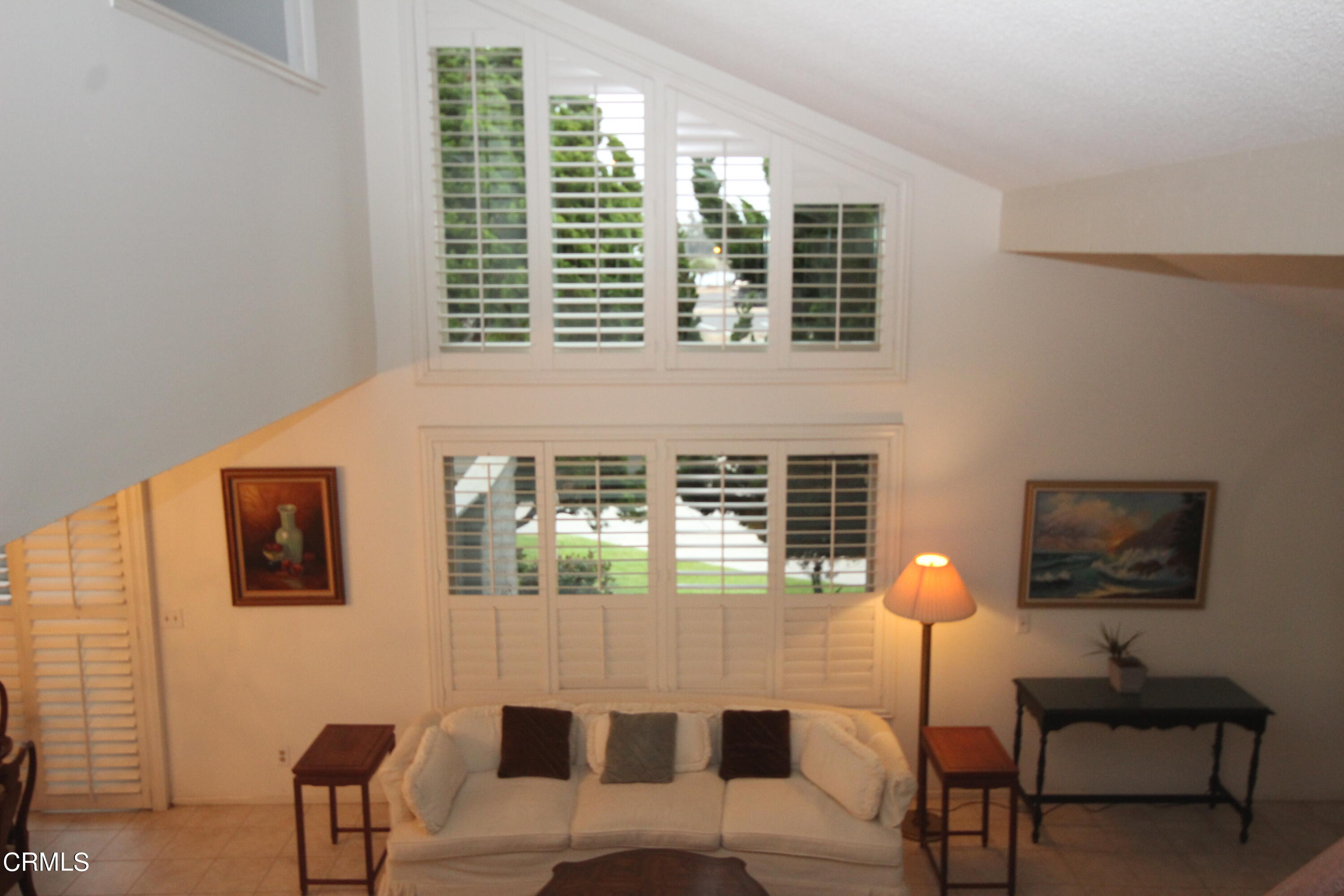 3354 Sunset Lane Oxnard, CA 93035 - Photo 12 of 12 a balcony with couch and a potted plant