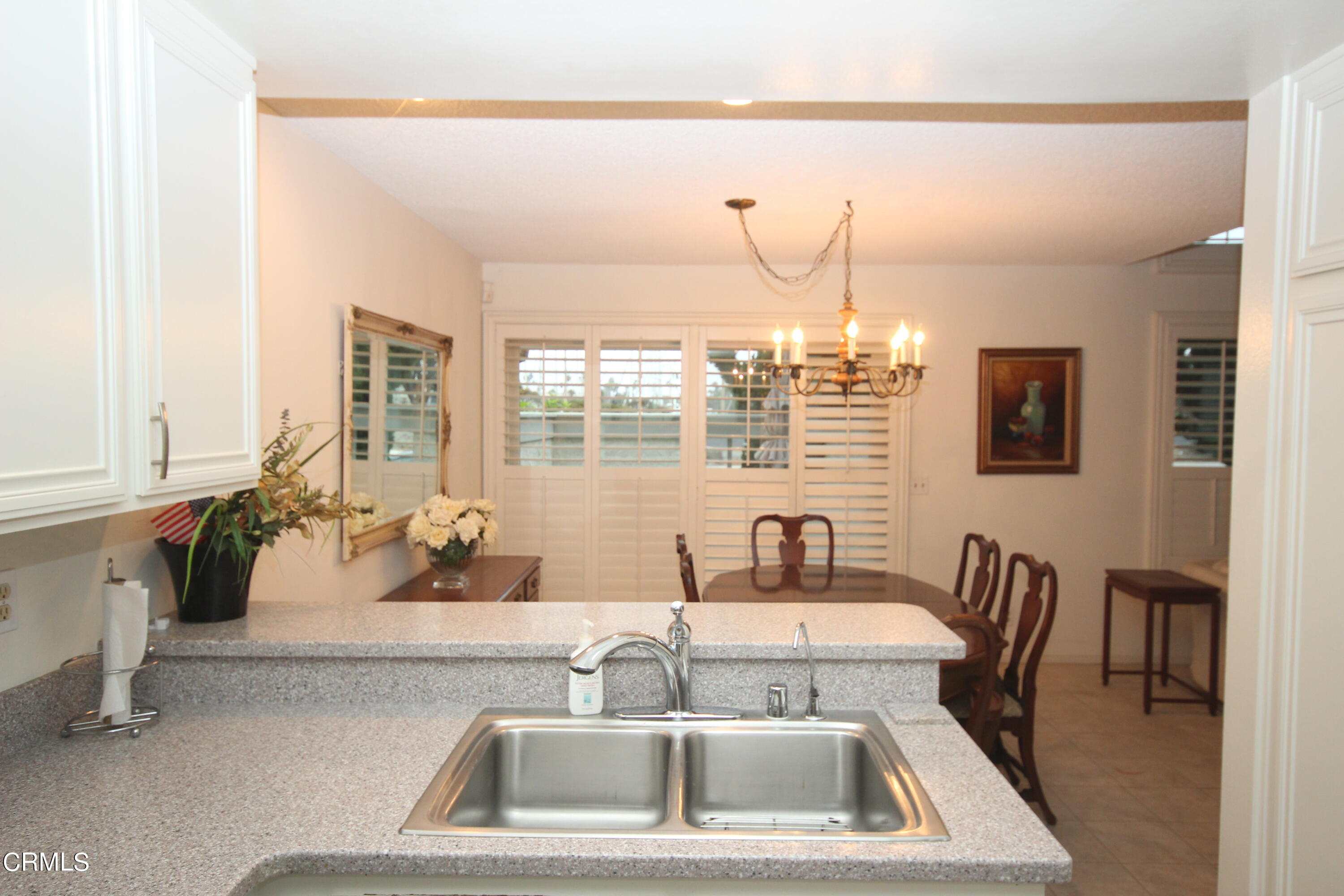 3354 Sunset Lane Oxnard, CA 93035 - Photo 5 of 12 a kitchen with a sink and a large window