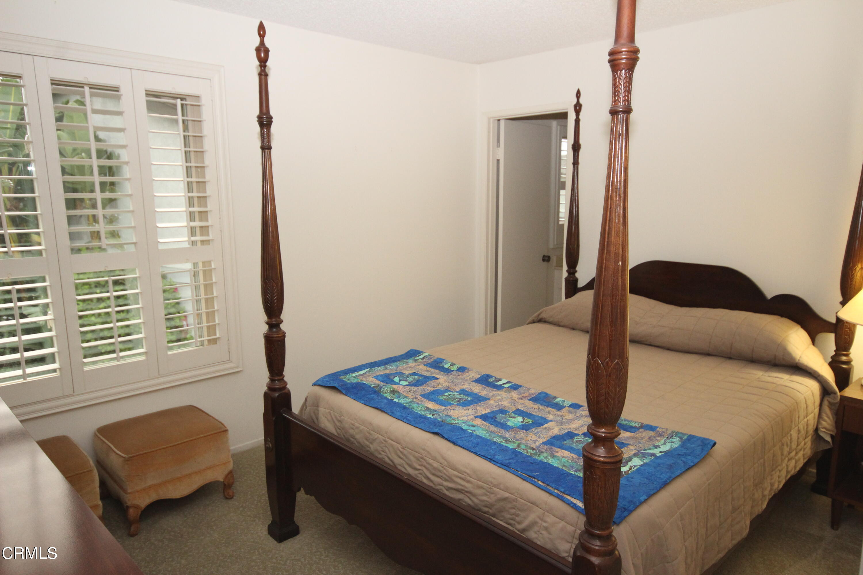 3354 Sunset Lane Oxnard, CA 93035 - Photo 8 of 12 a bedroom with a bed and a window