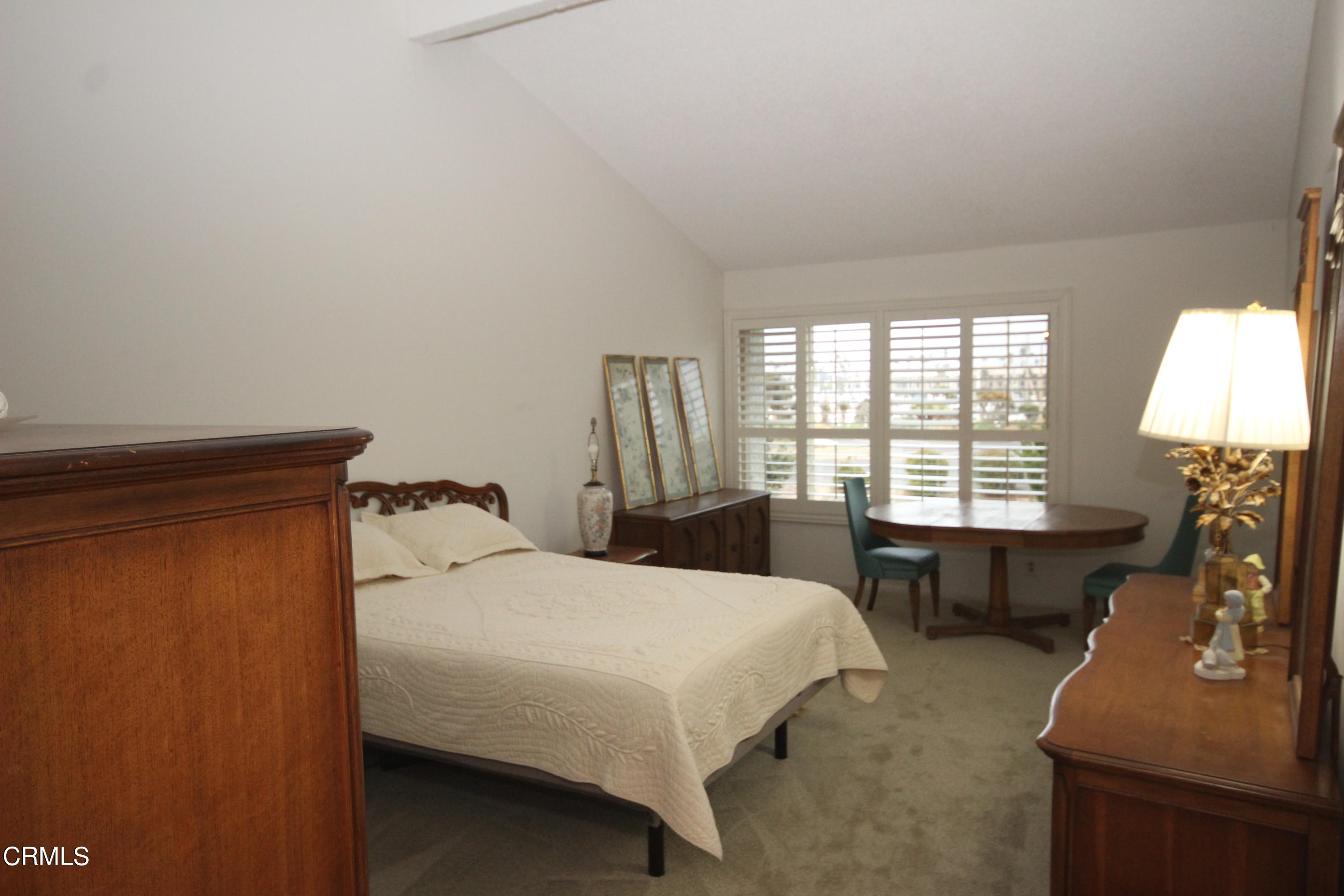 3354 Sunset Lane Oxnard, CA 93035 - Photo 10 of 12 a bedroom with a bed and a table