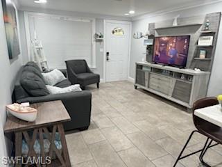 5322 Treetops Drive, Unit I Naples, FL 34113 - Photo 2 of 18 a living room with furniture and a flat screen tv