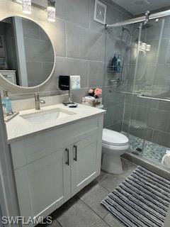 5322 Treetops Drive, Unit I Naples, FL 34113 - Photo 8 of 18 a bathroom with a sink toilet and shower
