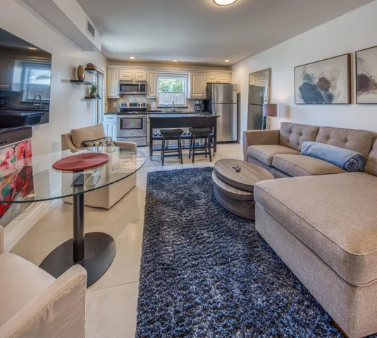 a living room with furniture and a table