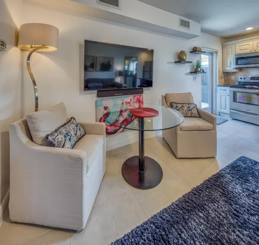 a room with furniture and a potted plant