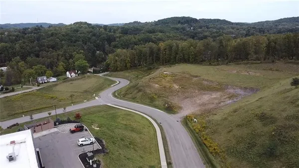 a view of a backyard with a road