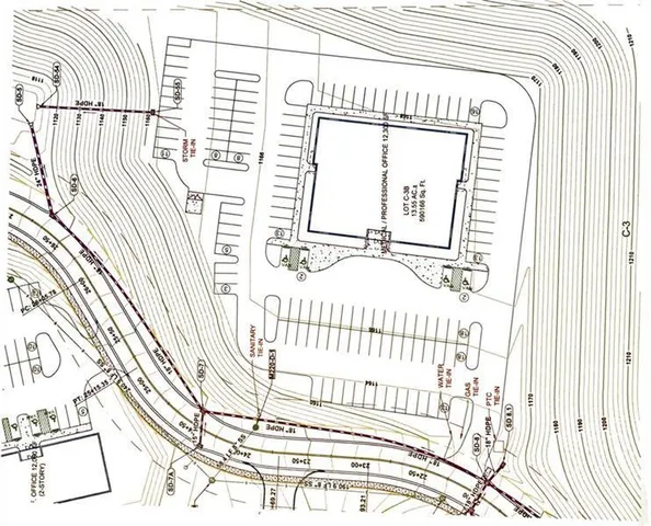 a view of a bedroom with wooden floor