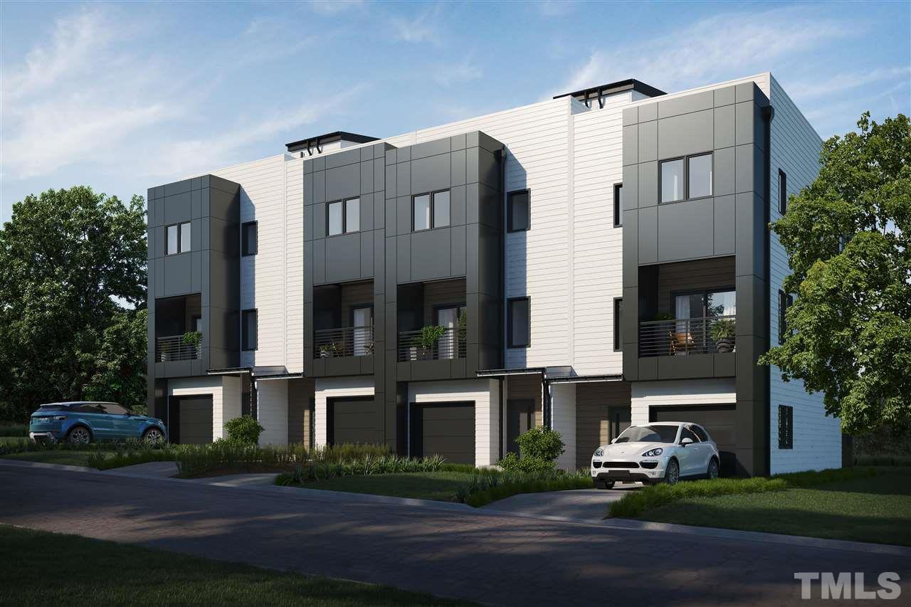 1027 Gregg Street Raleigh, NC 27601 - Photo 1 of 29 a front view of a residential apartment building with a yard