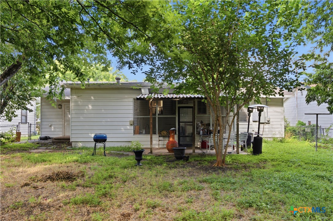 503 Cardinal Avenue Killeen, TX 76541 - Photo 26 of 26 a view of a backyard with wooden fence and a large tree