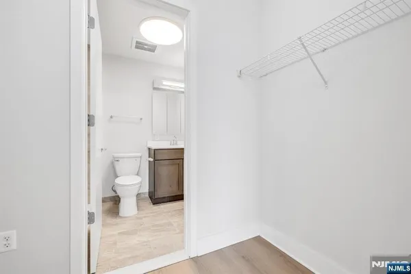 a bathroom with a toilet and a vanity