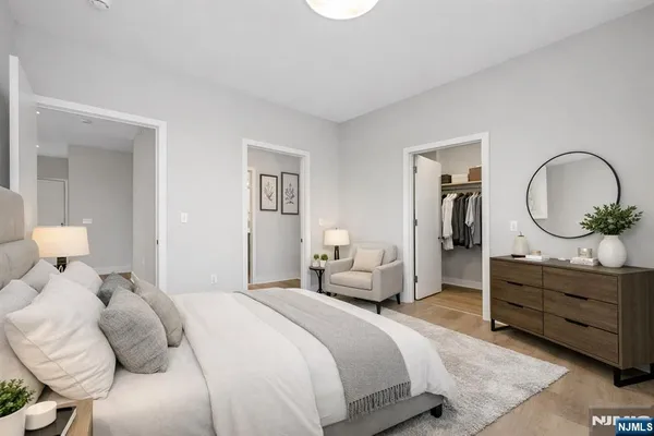 a bedroom with a bed and a dresser