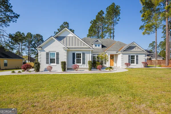 a front view of a house with swimming pool having outdoor seating