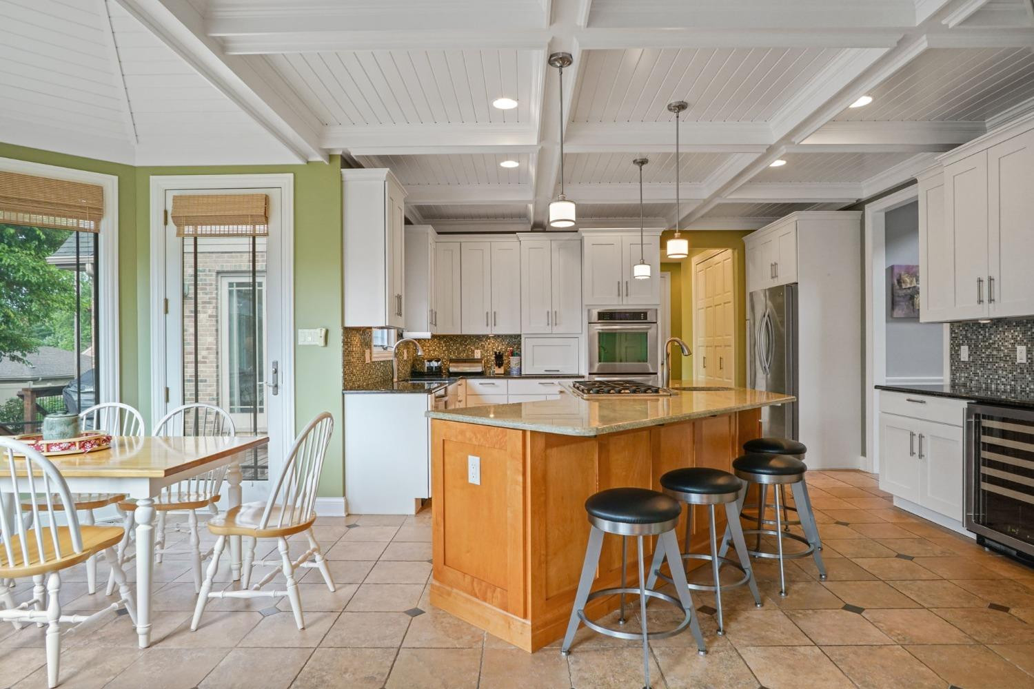 1435 Ridge Road Munster, IN 46321 - Photo 19 of 63 a large kitchen with a table and chairs in it