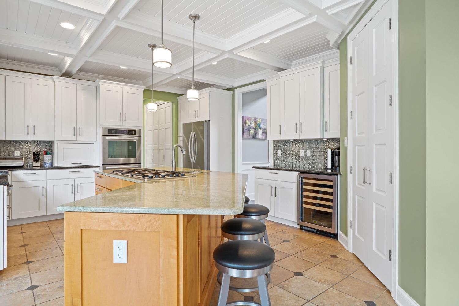 1435 Ridge Road Munster, IN 46321 - Photo 21 of 63 a kitchen with stainless steel appliances kitchen island granite countertop a refrigerator and a stove top oven
