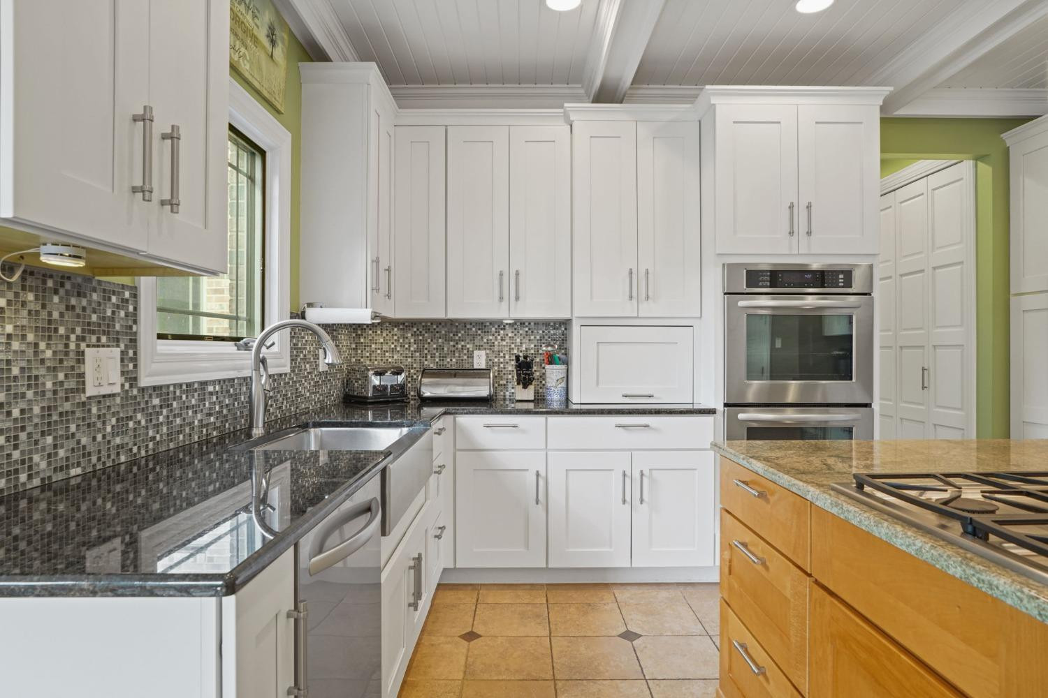 1435 Ridge Road Munster, IN 46321 - Photo 22 of 63 a kitchen with stainless steel appliances granite countertop a stove and a refrigerator