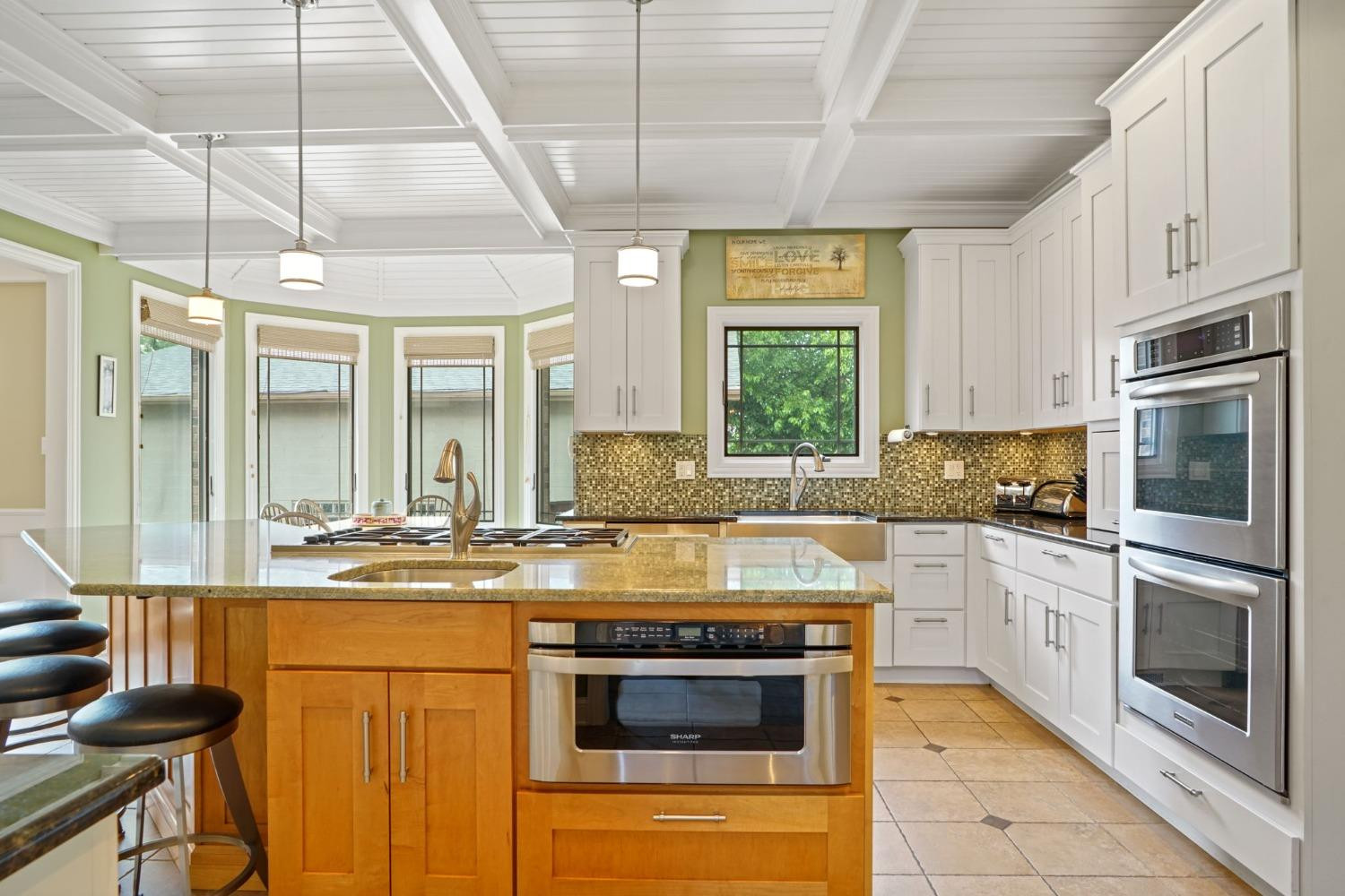 1435 Ridge Road Munster, IN 46321 - Photo 24 of 63 a kitchen with stainless steel appliances granite countertop a stove and a sink
