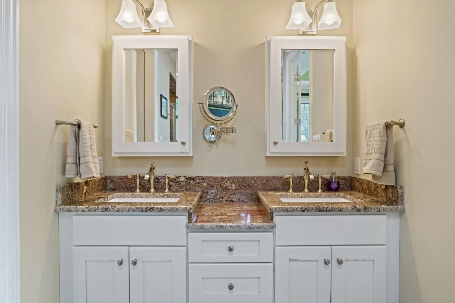 1435 Ridge Road Munster, IN 46321 - Photo 26 of 63 a bathroom with double sink and a mirror