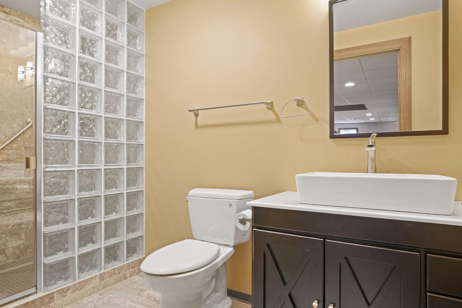 1435 Ridge Road Munster, IN 46321 - Photo 42 of 63 a bathroom with a toilet a sink and mirror