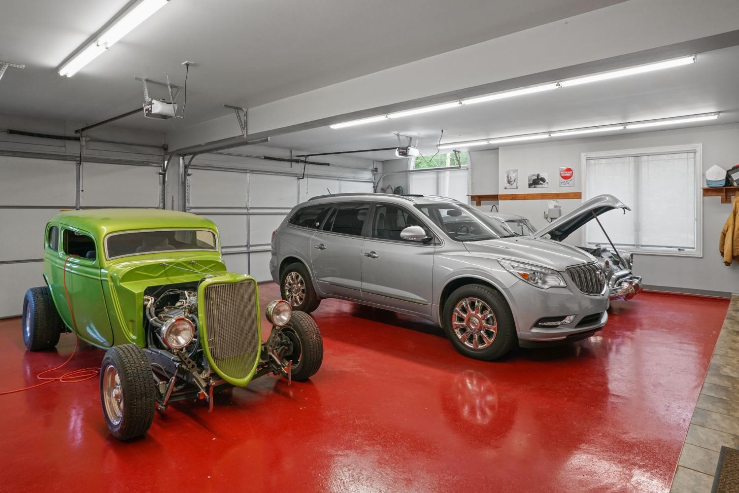 1435 Ridge Road Munster, IN 46321 - Photo 45 of 63 a car and bike parked in a garage
