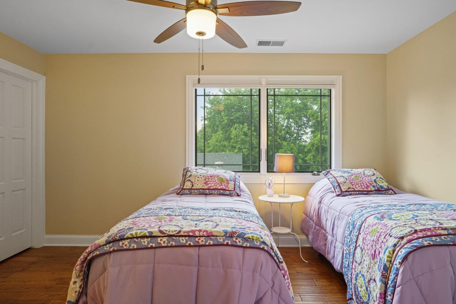 1435 Ridge Road Munster, IN 46321 - Photo 57 of 63 a bedroom with two beds and a chandelier