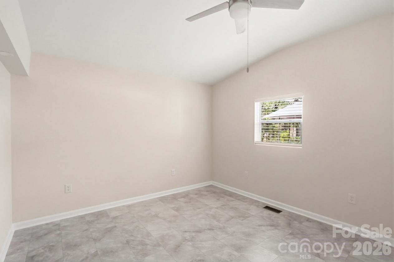 605 Ridgewood Court Mount Holly, NC 28120 - Photo 15 of 32 an empty room with a hallway