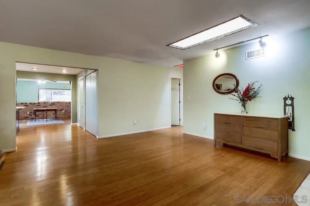 9337 Goyette Place Santee, CA 92071 - Photo 12 of 20 a view of a room with wooden floor and furniture