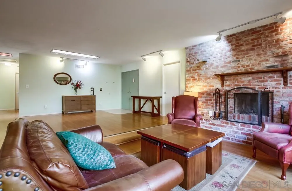 9337 Goyette Place Santee, CA 92071 - Photo 13 of 20 a living room with furniture and a fireplace