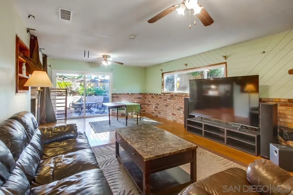 9337 Goyette Place Santee, CA 92071 - Photo 19 of 20 a living room with furniture and a flat screen tv