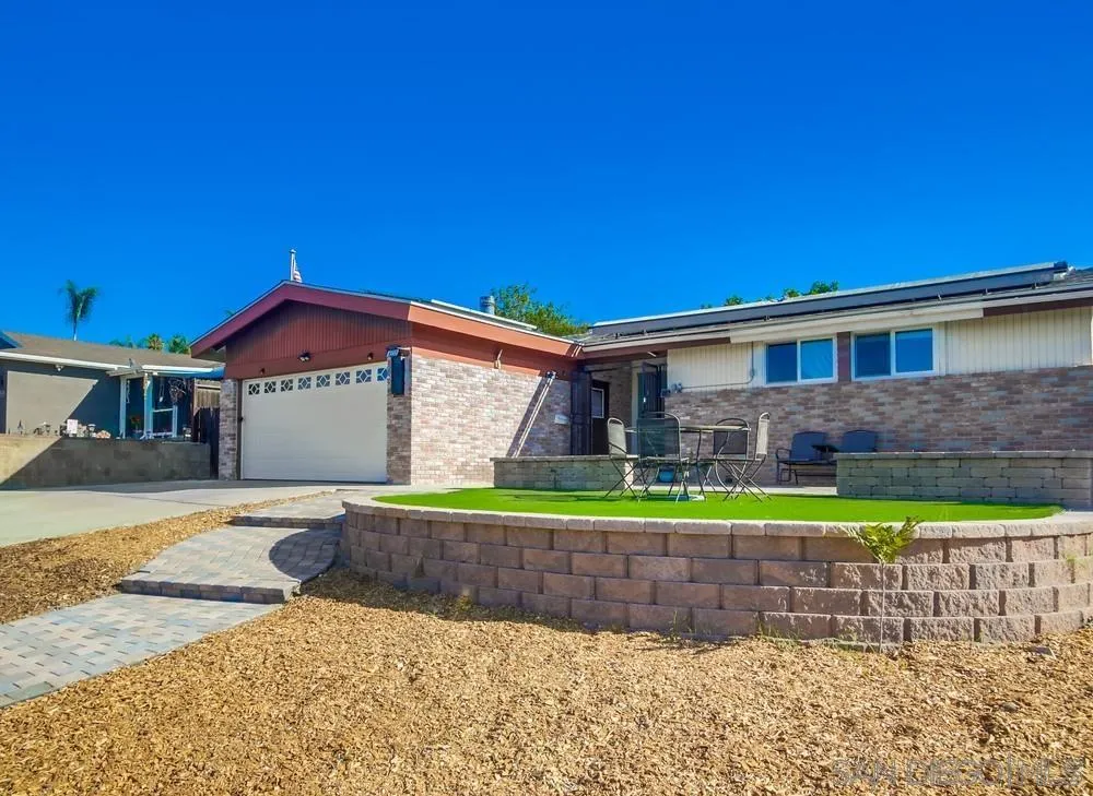 9337 Goyette Place Santee, CA 92071 - Photo 3 of 20 a front view of a house with a yard and potted plants
