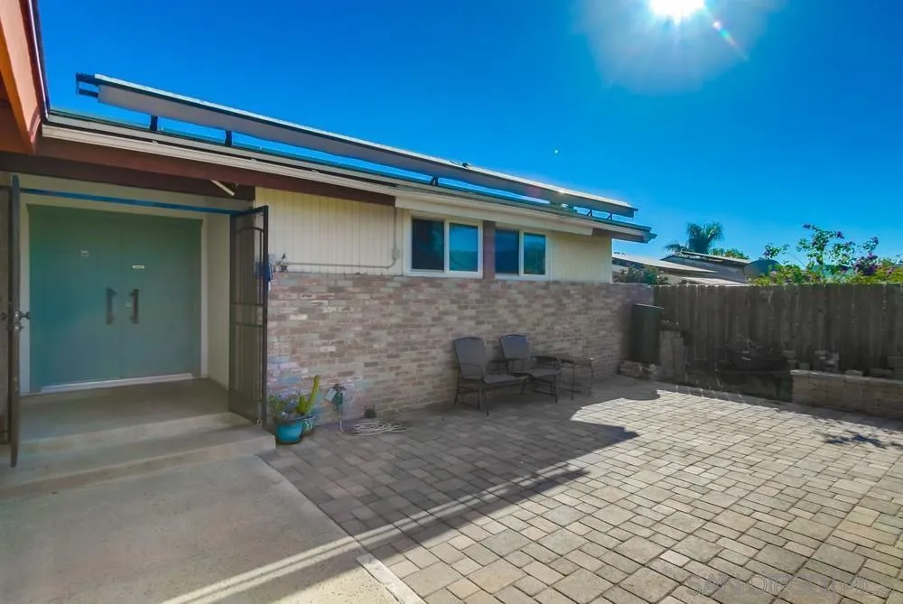 9337 Goyette Place Santee, CA 92071 - Photo 4 of 20 a front view of a house with garden