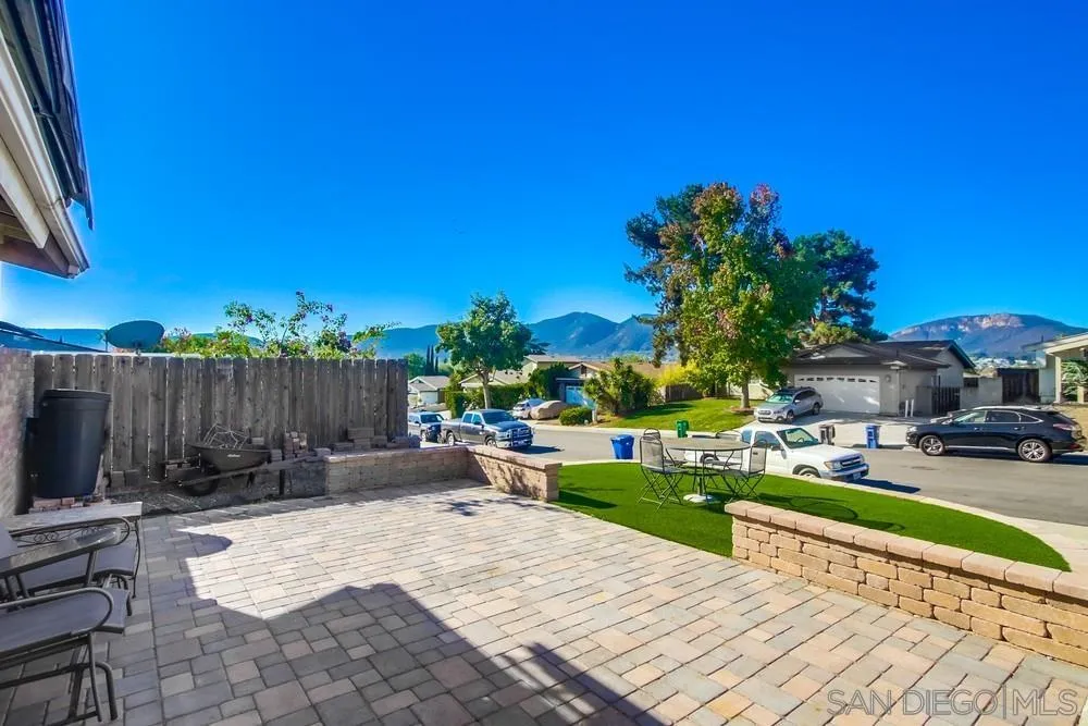 9337 Goyette Place Santee, CA 92071 - Photo 5 of 20 a view of a backyard with couches plants and wooden fence