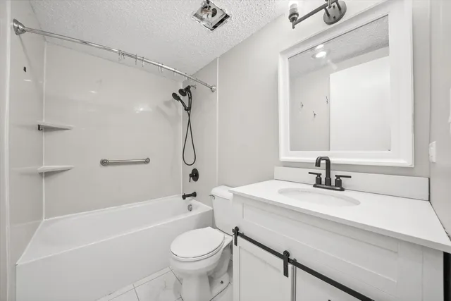 a bathroom with a sink a toilet and a bathtub