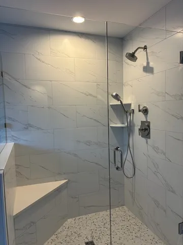 a view of a room with wooden floor