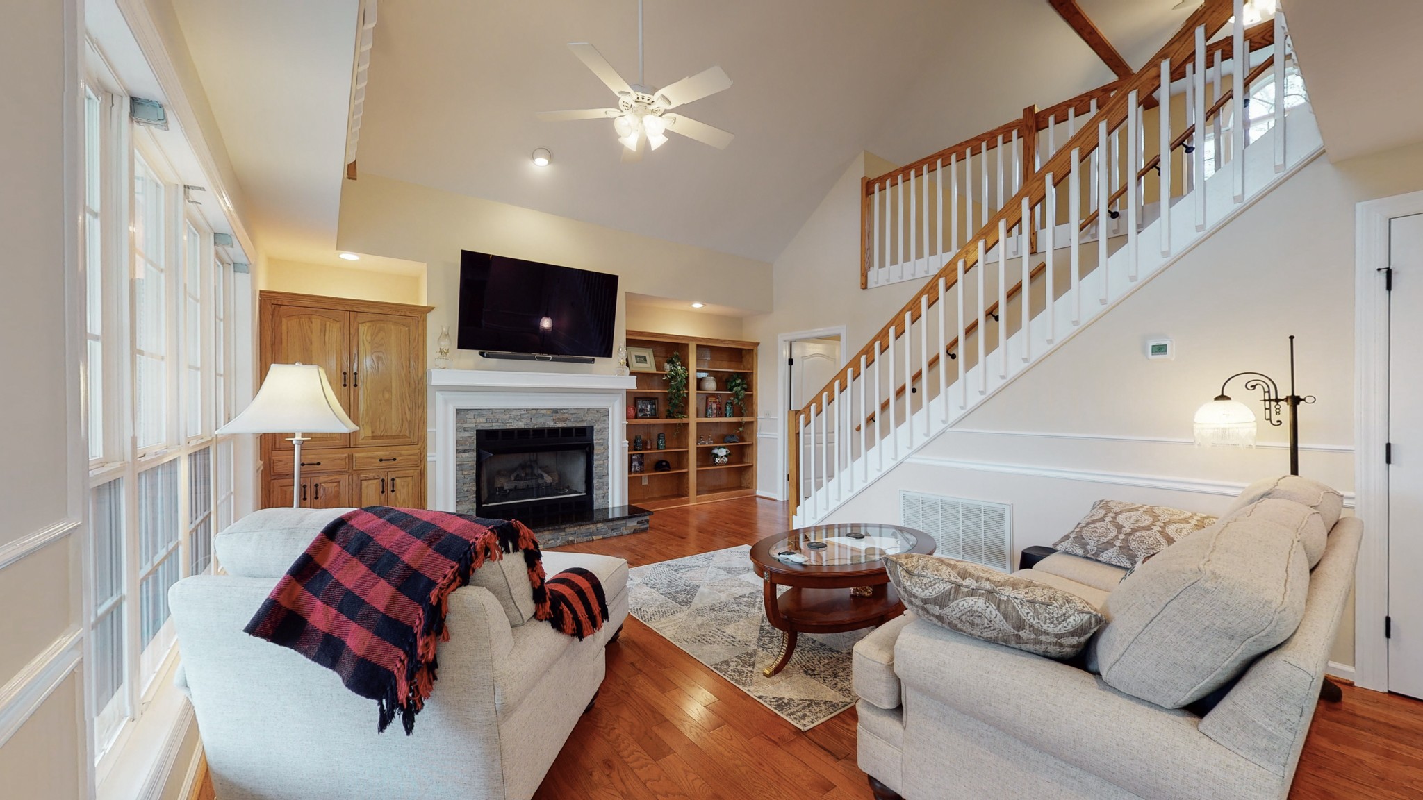199 Spicer Road Burns, TN 37029 - Photo 17 of 34 a living room with furniture a flat screen tv and a fireplace