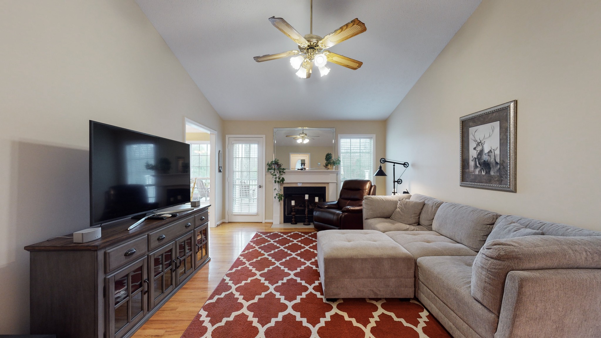 199 Spicer Road Burns, TN 37029 - Photo 24 of 34 a living room with furniture and a flat screen tv