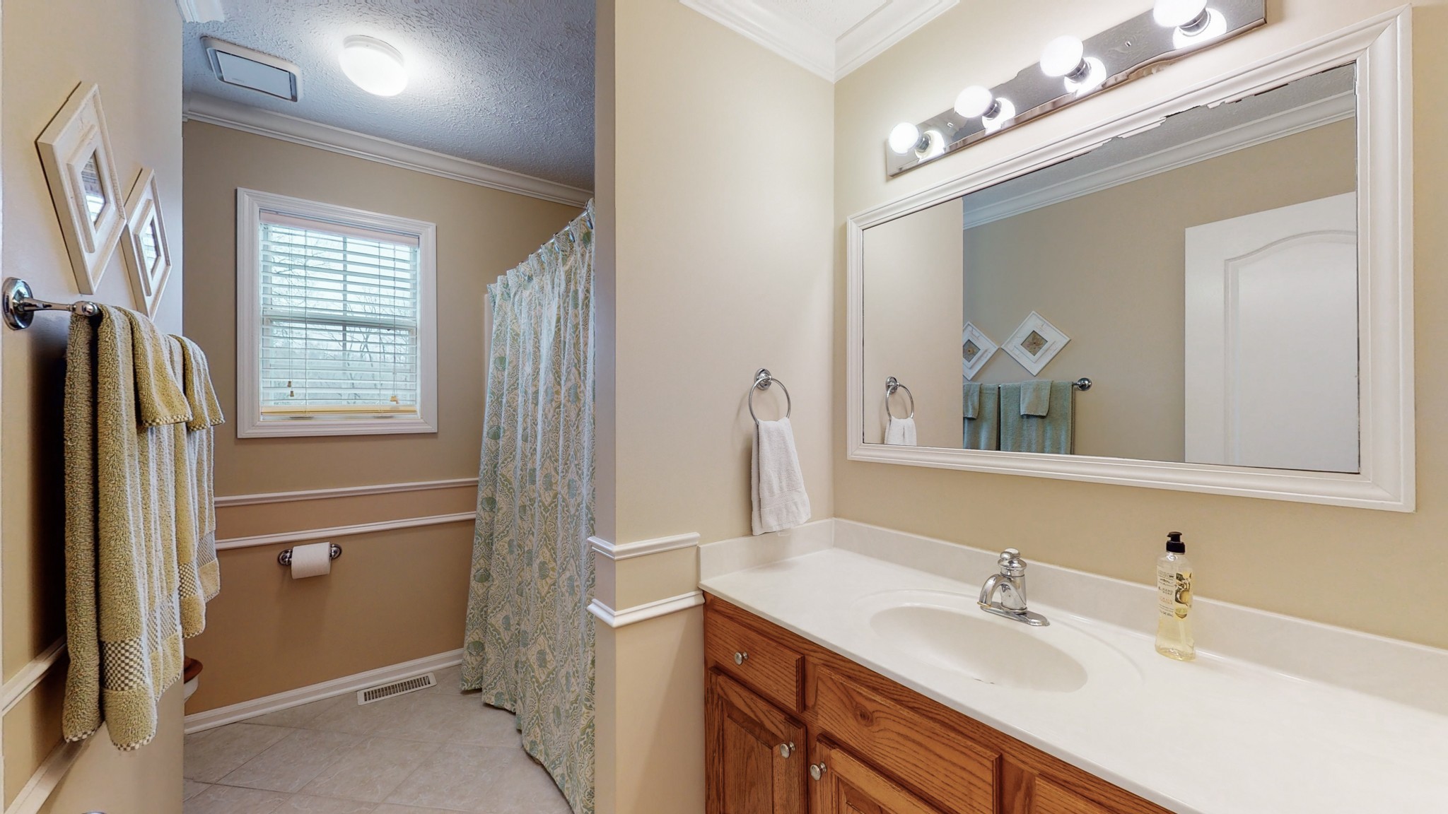 199 Spicer Road Burns, TN 37029 - Photo 32 of 34 a bathroom with a double vanity sink mirror and double