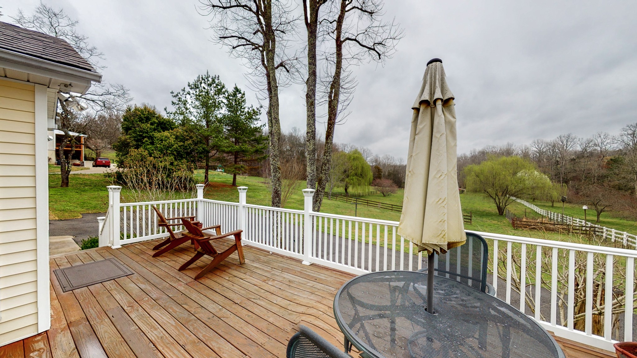 199 Spicer Road Burns, TN 37029 - Photo 5 of 34 a view of a chairs and tables in the balcony