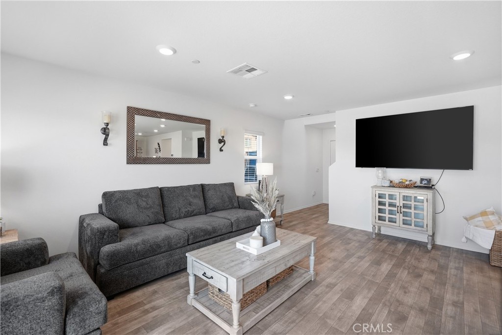 28395 Matador Road Winchester, CA 92596 - Photo 11 of 56 a living room with furniture and a flat screen tv