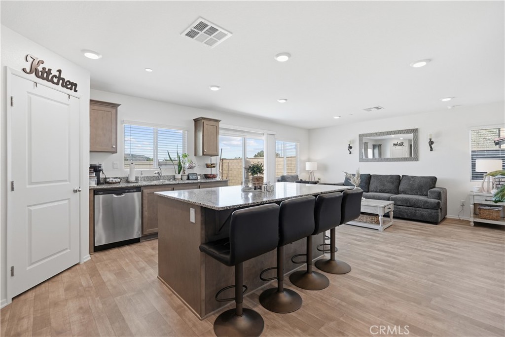28395 Matador Road Winchester, CA 92596 - Photo 12 of 56 a kitchen with a sink cabinets and wooden floor