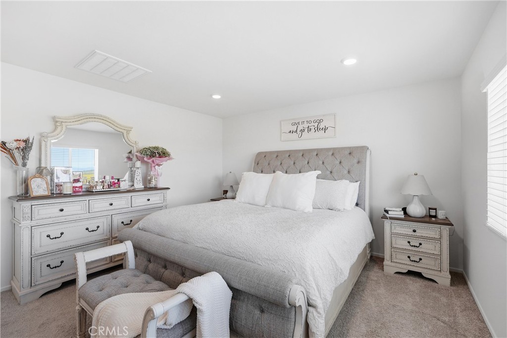 28395 Matador Road Winchester, CA 92596 - Photo 21 of 56 a bedroom with a bed and a dresser