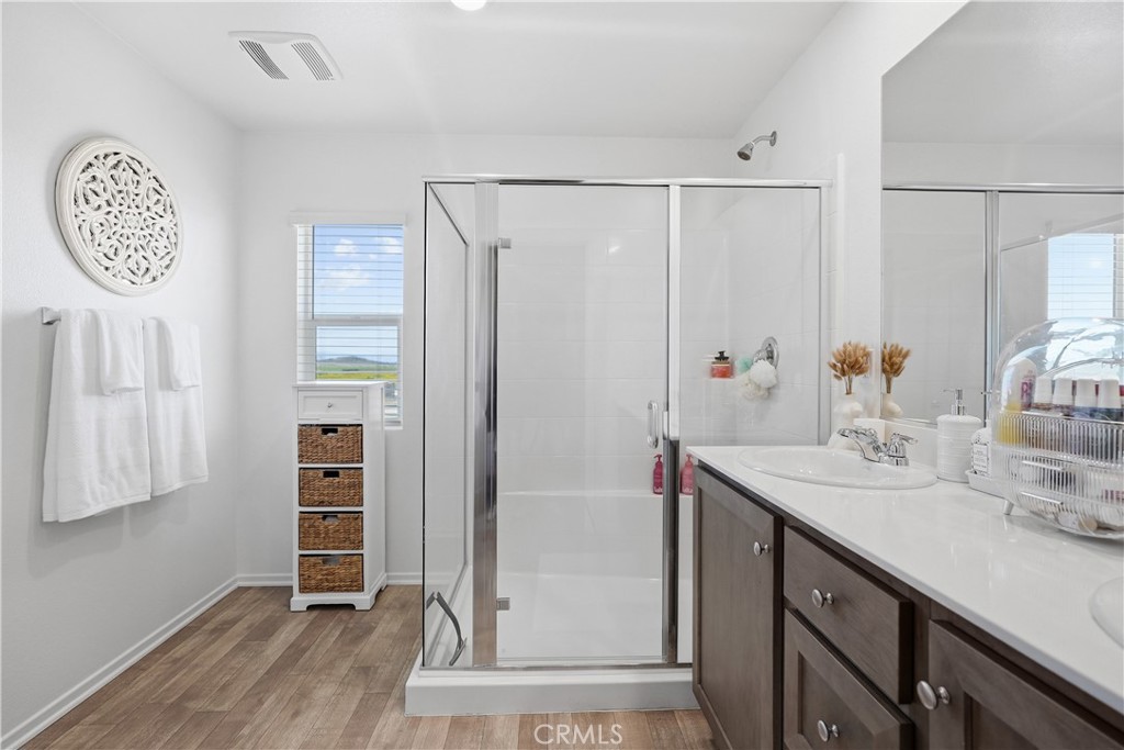 28395 Matador Road Winchester, CA 92596 - Photo 25 of 56 a bathroom with a sink a vanity and a mirror
